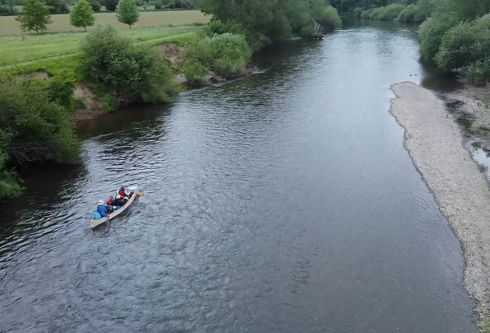 Aerial view of a family canoeing on the River Wye.