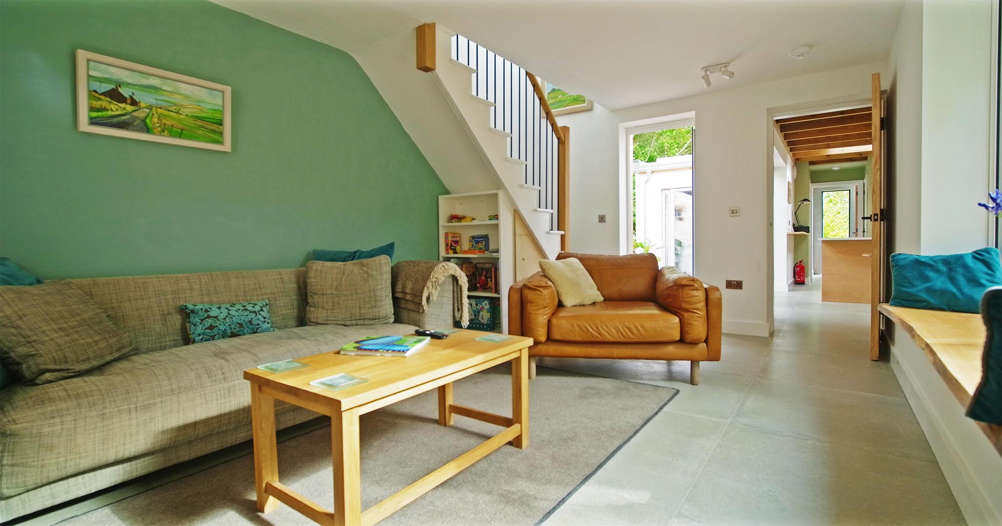 Lounge at Fernleigh Courtyard holiday cottage with views through to the kitchen-diner, courtyard and stairs.