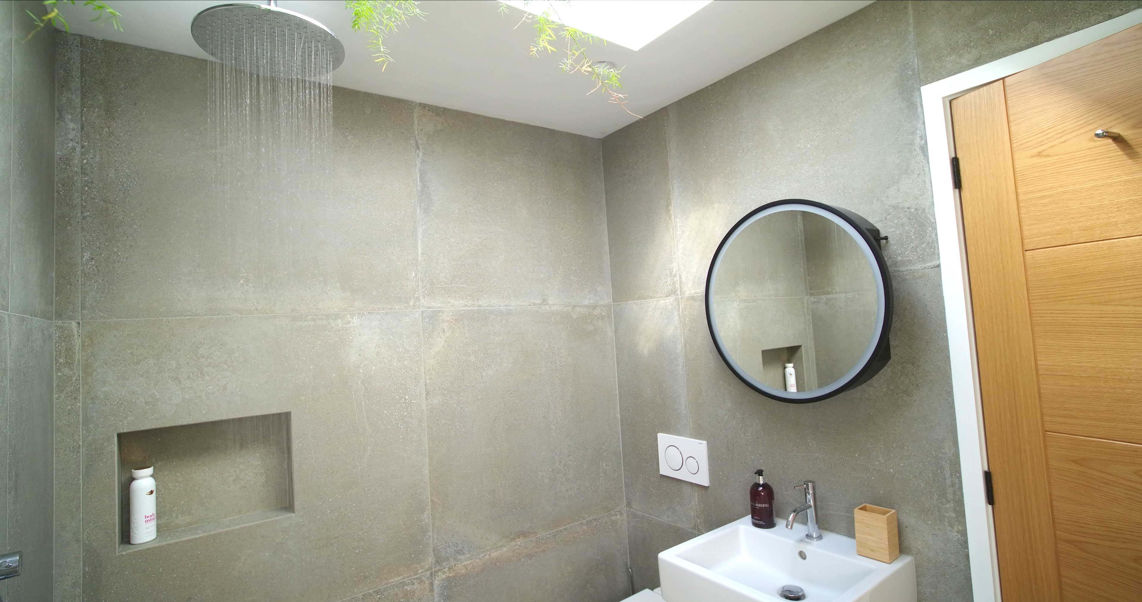 Water flowing from the rain shower in the wet room at Fernleigh Courtyard holiday cottage in the Wye Valley at Brockweir.